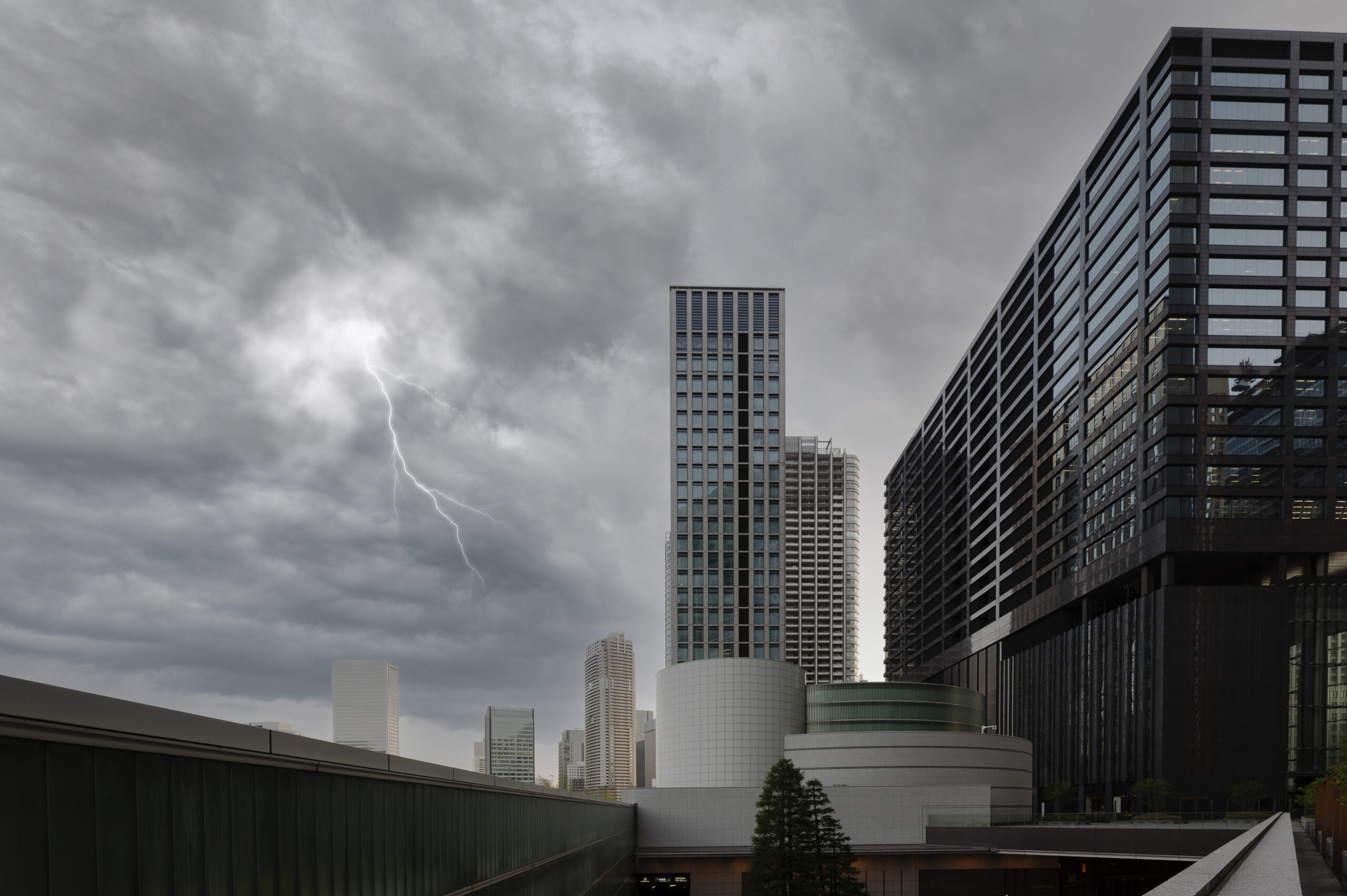 thunderstorm approaching modern city buildings
