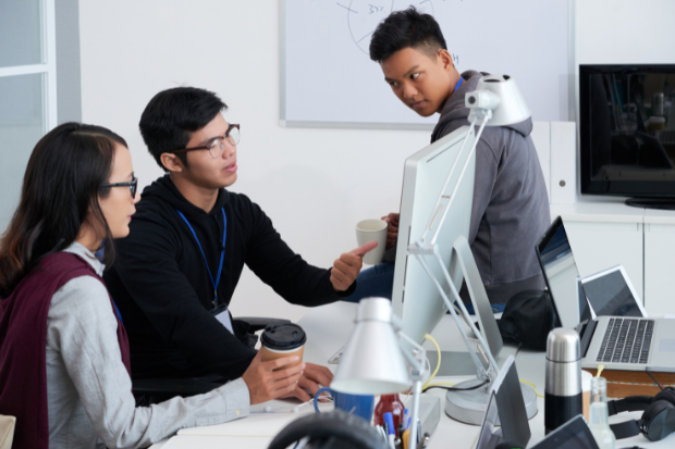 Business technology team discussing AI and digital workflows