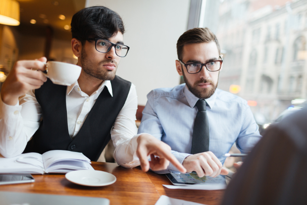 Businessmen listening during a meeting