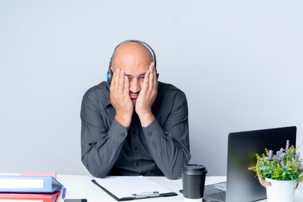 Tired young call centre worker